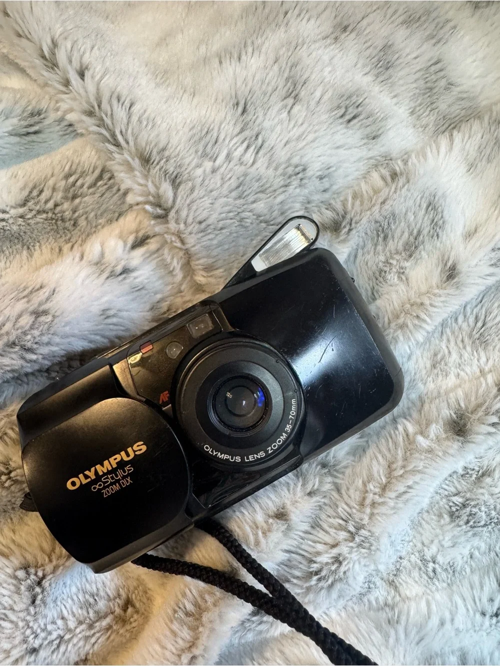 Olympus compact film camera in black with built-in flash